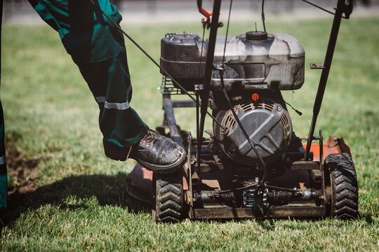 lawn care worker,maintaining yard, mowing grass