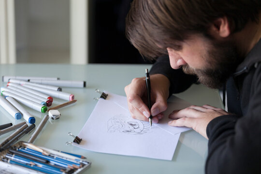 Man drawing on table
