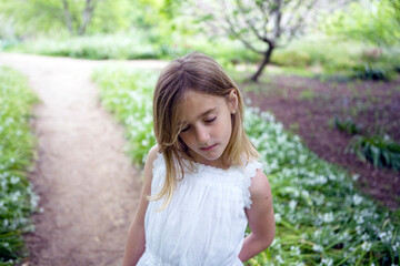 Girl With Closed Eyes Standing on a Path