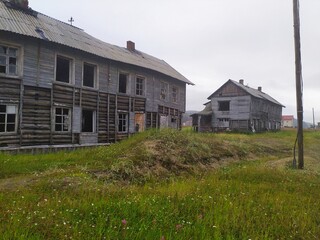 Obraz premium Old ruined abandoned wooden houses