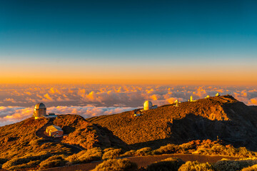 Observatories of Roque de los Muchachos in the Caldera de Taburiente in a beautiful orange sunset,...