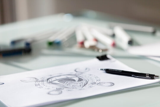 Drawing with pens and markers on a table