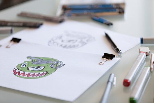 Drawings with pens and markers on a table