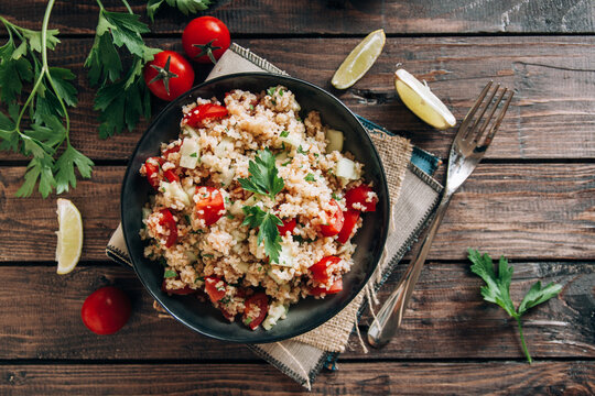 Fresh Lebanese Tabbouleh Salad on a wooden table