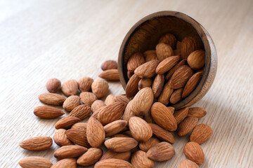 Close up,Almonds on the wood background,copy space.
