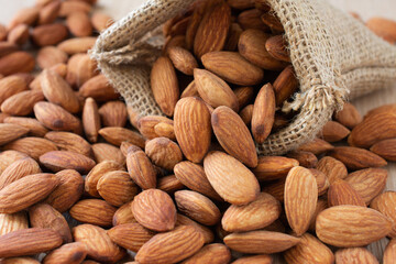 Close up,Almonds on the wood background.
