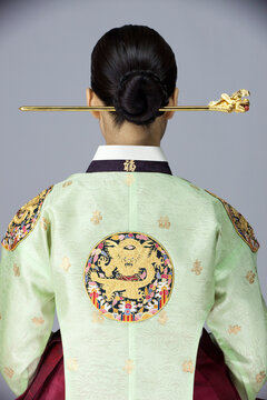back view of young woman in korean traditional clothing