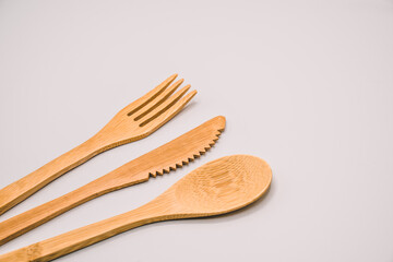Eco friendly bamboo cutlery set isolated background. Zero waste concept. wooden travel cutlery set,...