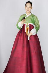 Fototapeta premium young woman in korean traditional clothing, hanbok