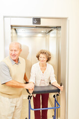 Fototapeta premium Old man helps a disabled woman