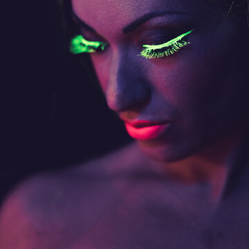Female portrait. Fluorescent make up