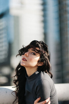 Woman with city backdrop