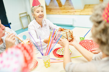 Old woman celebrates birthday in retirement home
