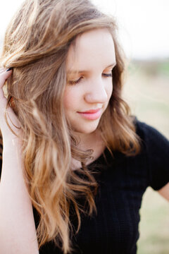Portrait of a teen girl in black top