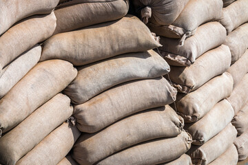 background made of sandbags to protect military and civilian objects. For protection from bullets and shrapnel, natural disasters, hurricanes, flooding, etc.