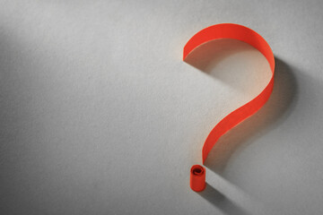 Colorful bright orange coiled paper question mark