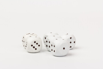 White gamble dice with black dots, isolated on white background.