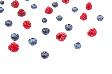 raspberries and blueberries isolated on white background
