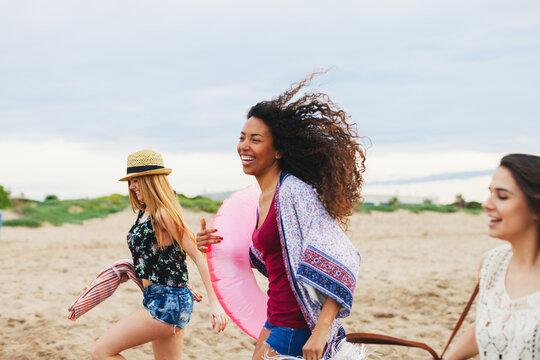 Young female friends having fun on the beach.