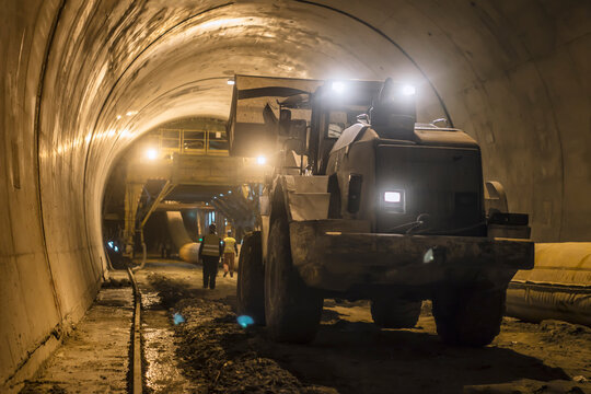bulldozer in a tunnel, working atmosphere