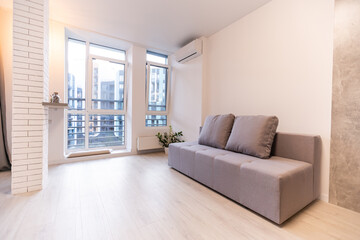 New cozy couch in modern room interior