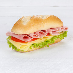 Sandwich with ham and cheese fresh square on wooden board
