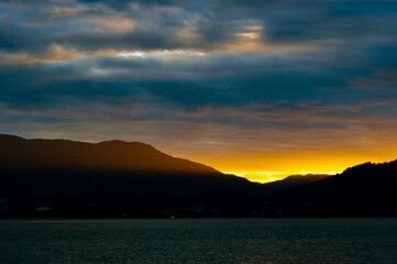 As the sun sets you see an incredible curtain of light passing through the mountain