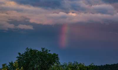 Bright and dark clouds looks like enigmatic figures in sky