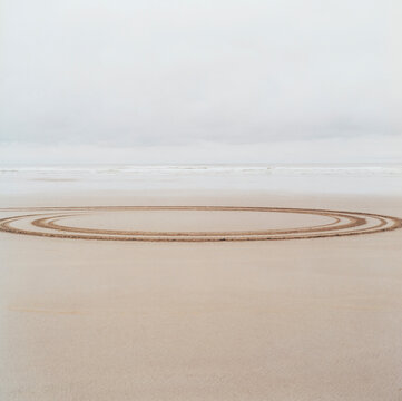 Circle tire tracks on beach
