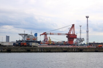 Naklejka premium August 21 2020 - Rostock-Warnemünde, Mecklenburg-Vorpommern/Germany: Details of the industry port and dockside cranes at the europort harbour in Rostock
