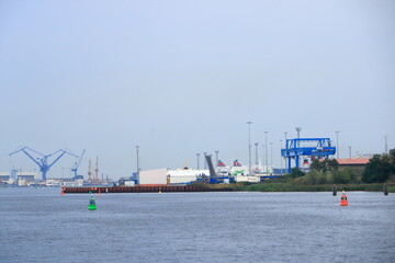 Fototapeta premium August 21 2020 - Rostock-Warnemünde, Mecklenburg-Vorpommern/Germany: A ferry arrives at the port of Rostock