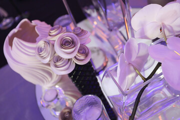Obraz na płótnie Canvas Hand folded paper flowers on a table for an event.