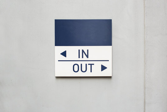 IN OUT Sign on the Wall