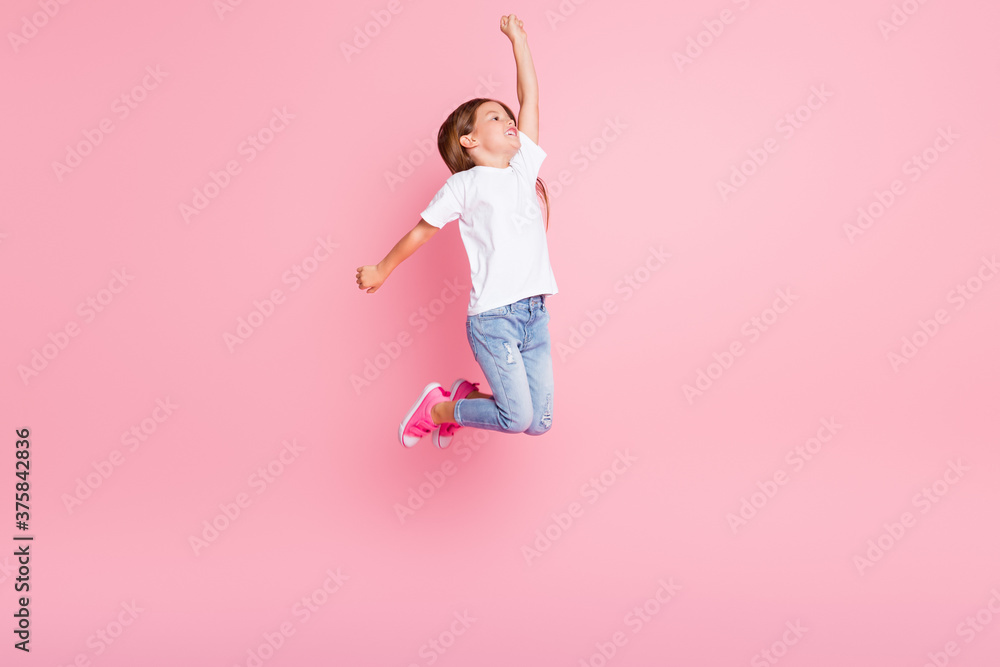 Sticker Full size profile side photo of powerful kid imagine she can save world like super hero jump raise fist look copyspace wear casual style outfit sneakers isolated pastel color background