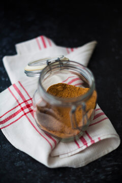 Healthful Coconut sugar sugar in glass jar on cotton kitchen cloth