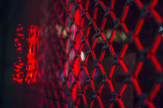 metal railing red neon light night atmosphere