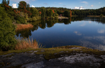 Sweden. Small house by the lake on an autumn day