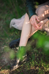 girl sitting in the park on the grass