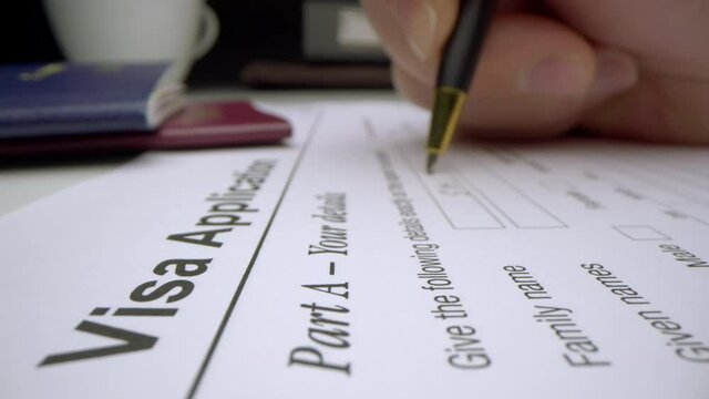 Motorized moving shot of completing visa application form, shot with macro probe lens