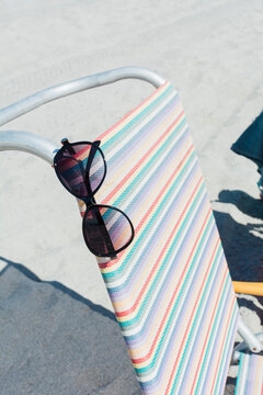 Sunglasses on beach chair. Florida.