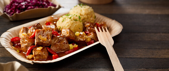 Takeaway serving of beef goulash and dumpling