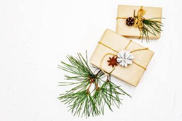Fototapeta na wymiar New Year or Christmas gifts with pine branches and cones as Zero waste concept