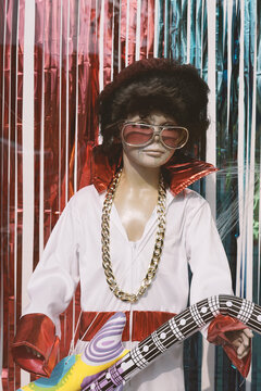 A mannequin dressed up as a young Elvis