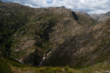 A deep valley between high mountains