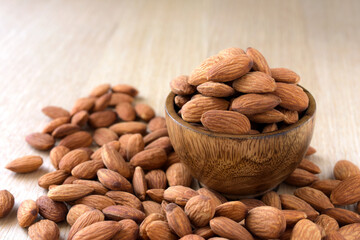 Almonds on the wood background,copy space.