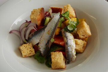 Delicious fresh caesar salad, with anchovies. Shallow dof