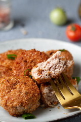 Piece of meat cutlet on a fork