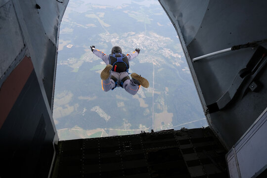 Skydiving. Start jump. A skydiver has just jumped out of a plane into the sky.