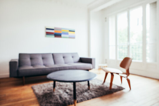 Minimalist Living Room With Designer Furniture Defocused