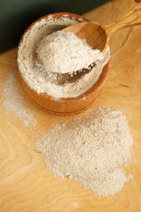 almond flour in bowl on wooden surface